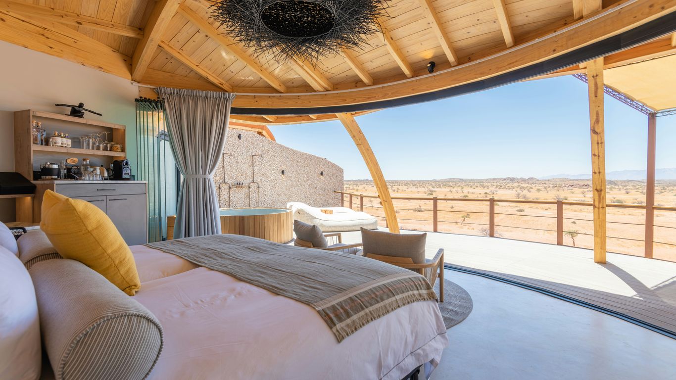 a bedroom with a view of the desert