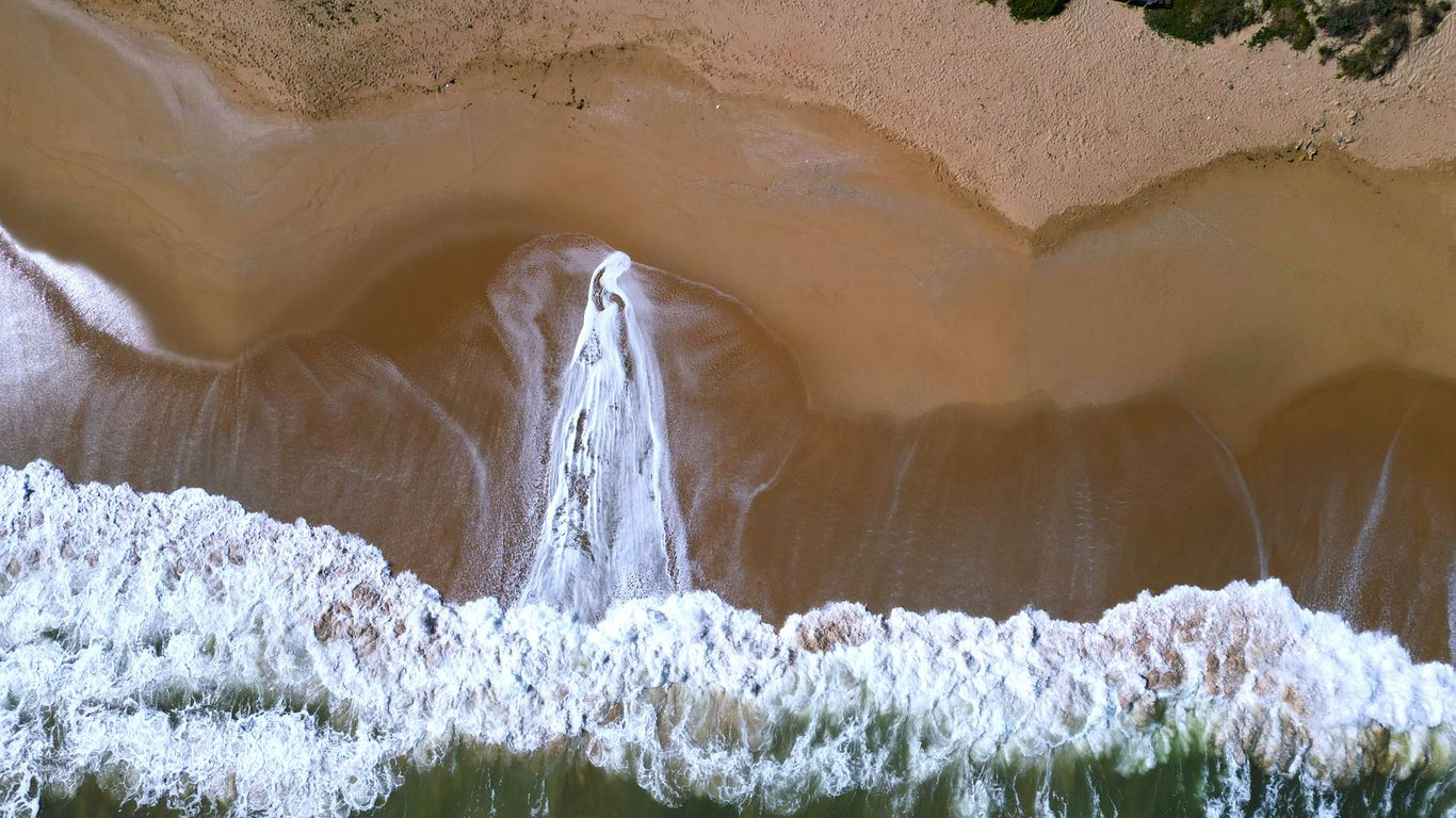 An aerial view of a waterfall in the water