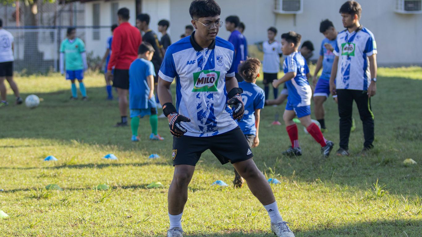 a group of young men playing a game of soccer