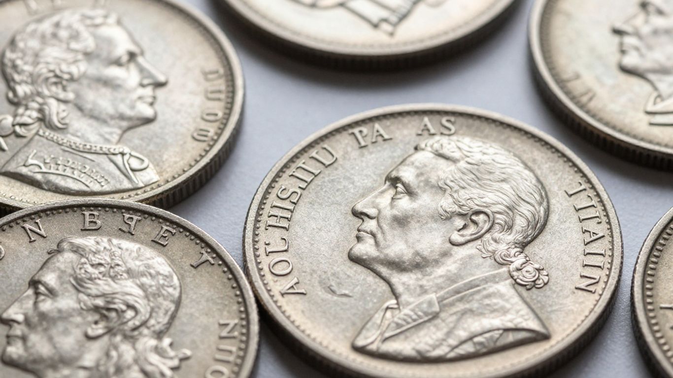 Close-up of shiny silver constitutional coins.