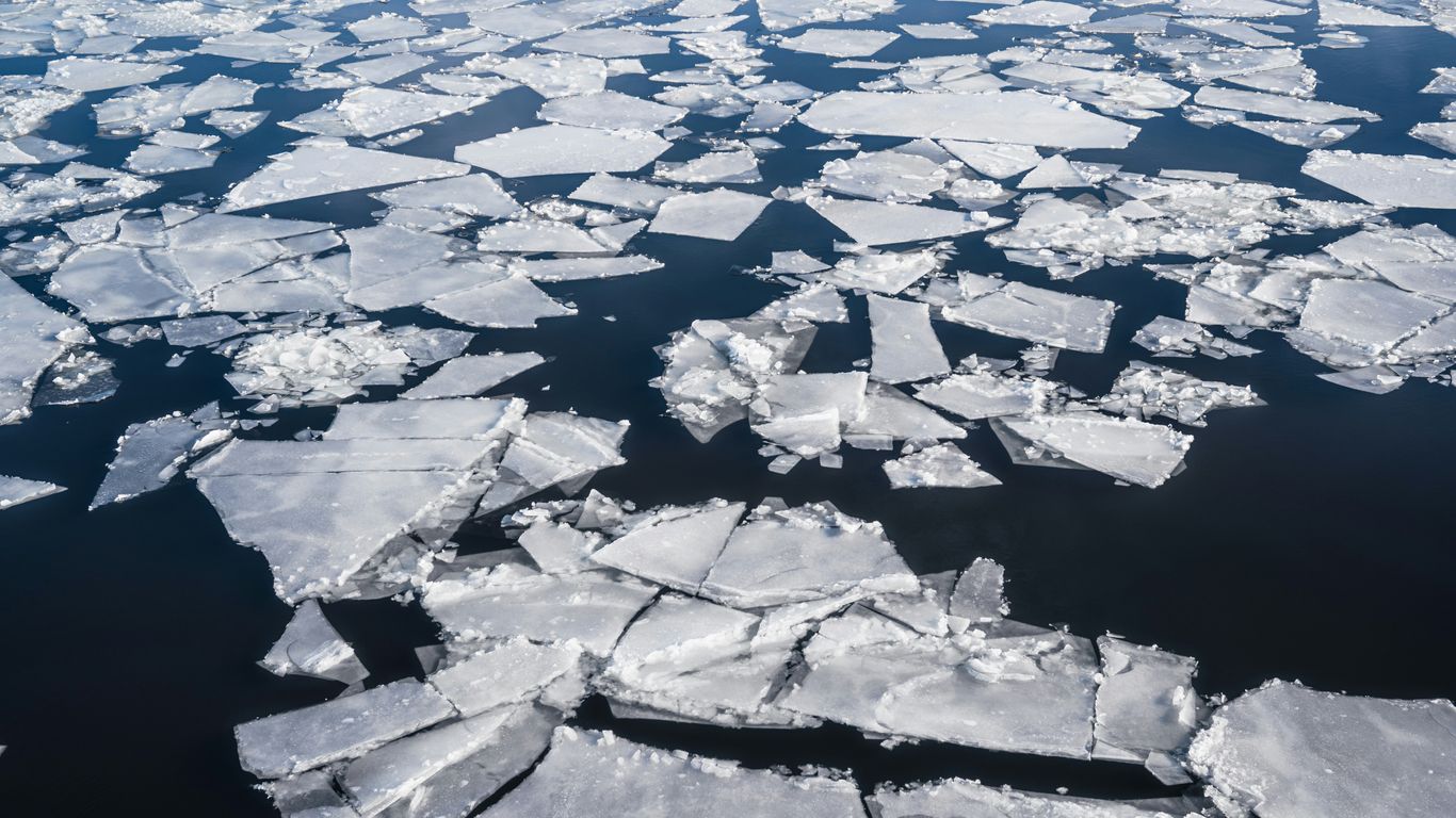 an aerial view of ice floes floating in the water