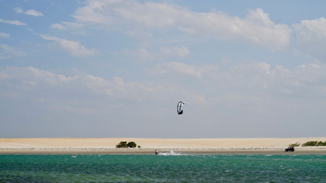 a person riding a surf board on top of a body of water