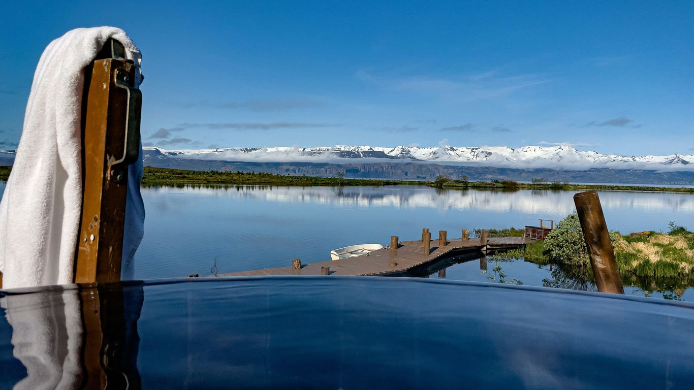 a pool with a view of a mountain range