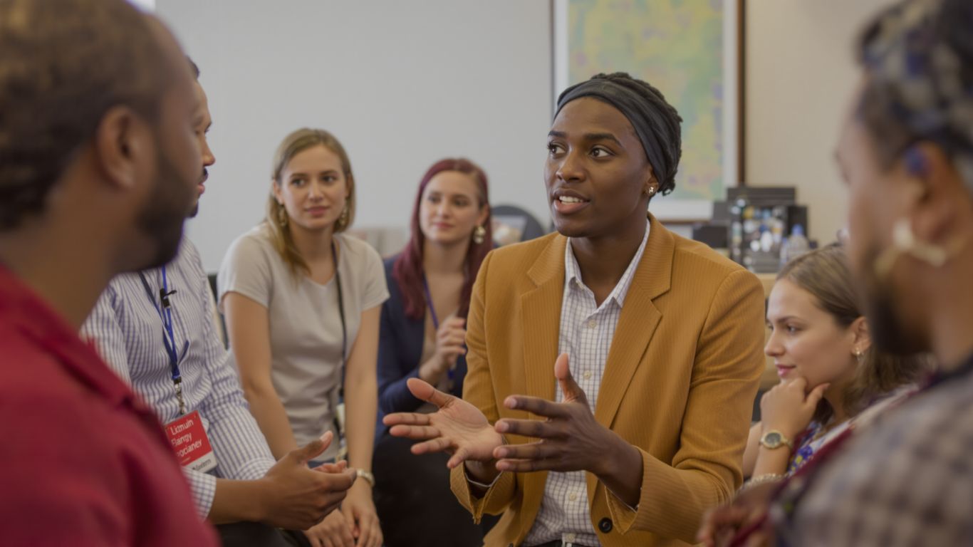 People discussing mental capacity principles in a supportive setting.