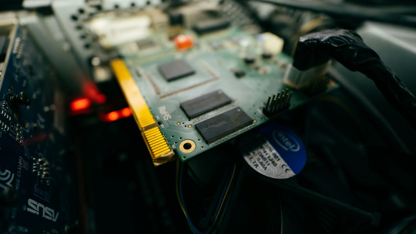 a close up of a computer motherboard with wires