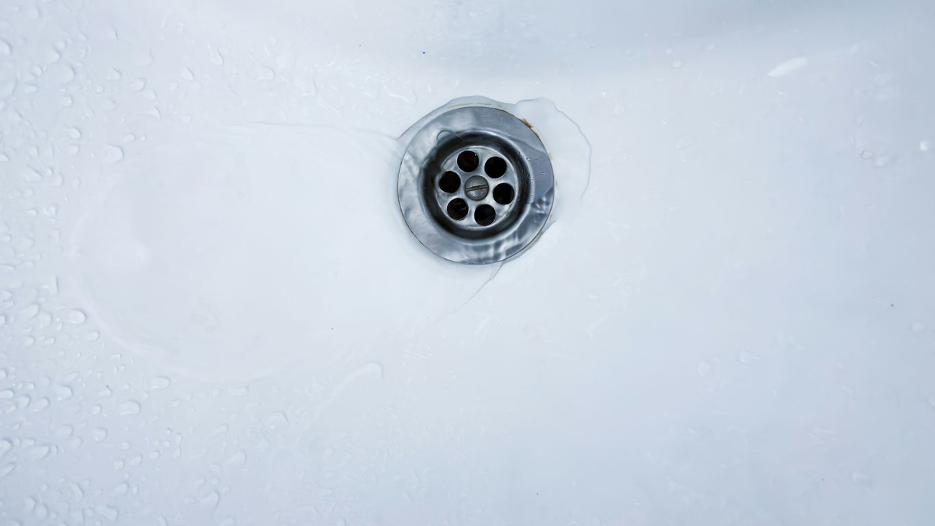 Water drains into a sink.