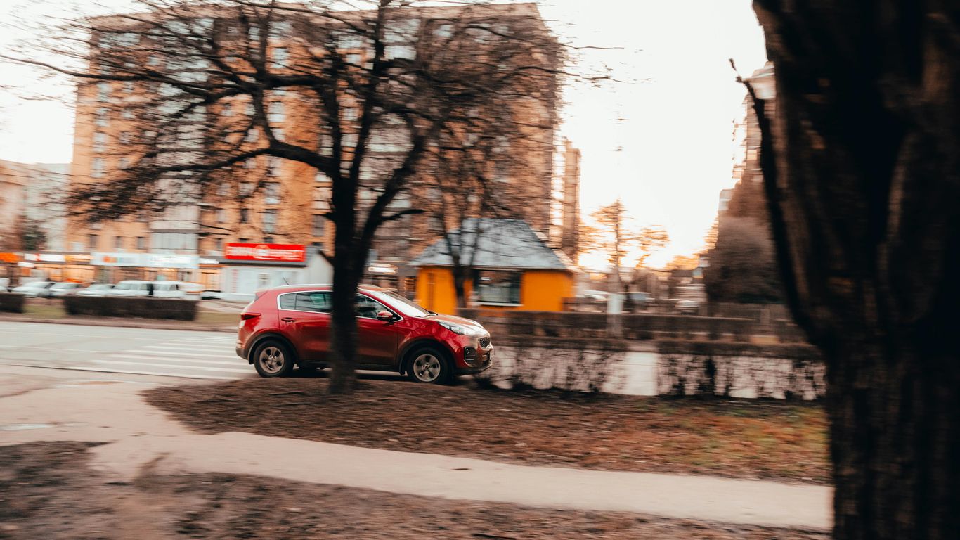 a red car parked on a street