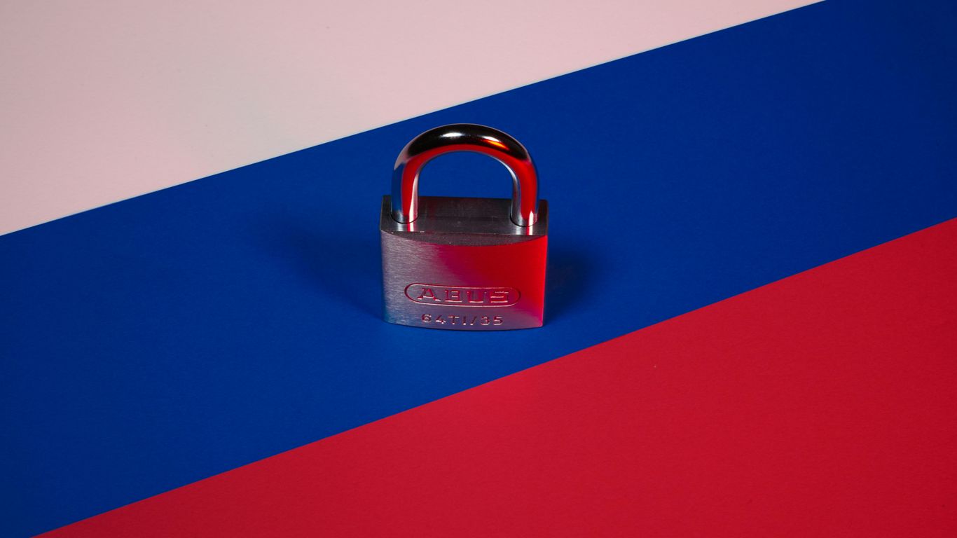 a padlock on a red, blue, and pink background