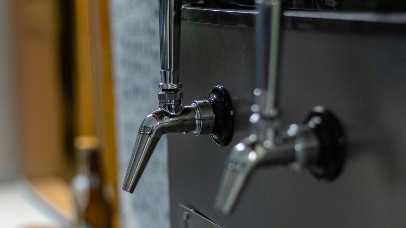 selective focus photography of gray faucets