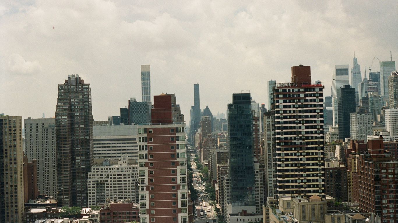 a view of a city with tall buildings