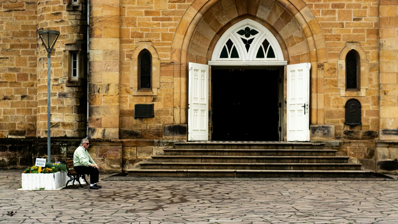 man sitting on brown chair