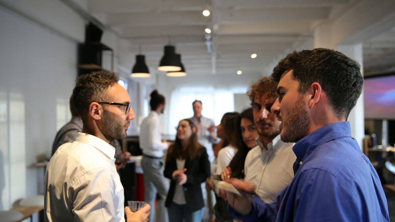 a group of people standing in a room