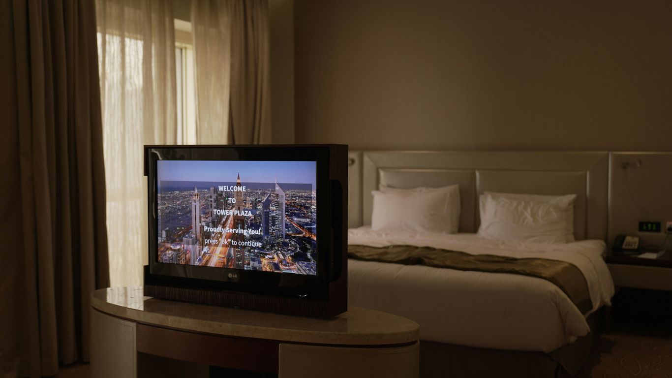a flat screen tv sitting on top of a table