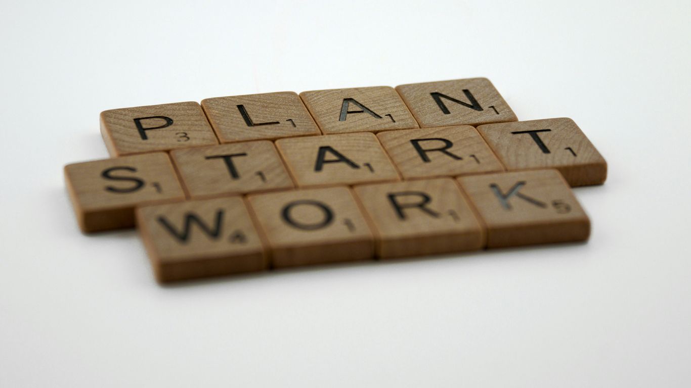 scrabble tiles spelling plan, start, and work