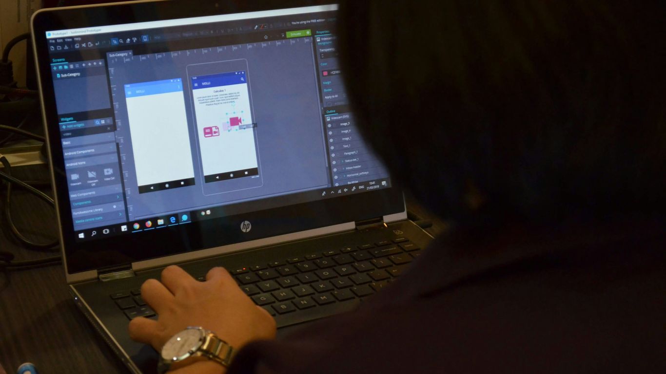 woman using black laptop computer