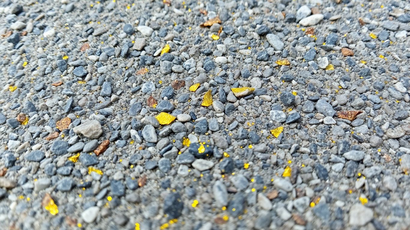 Granite rock with glittering yellow metallic flecks.