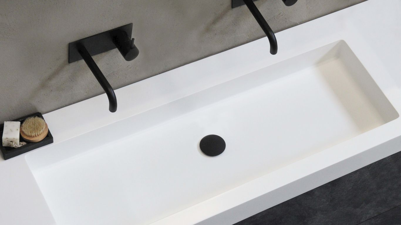 black rolling office chair beside white table