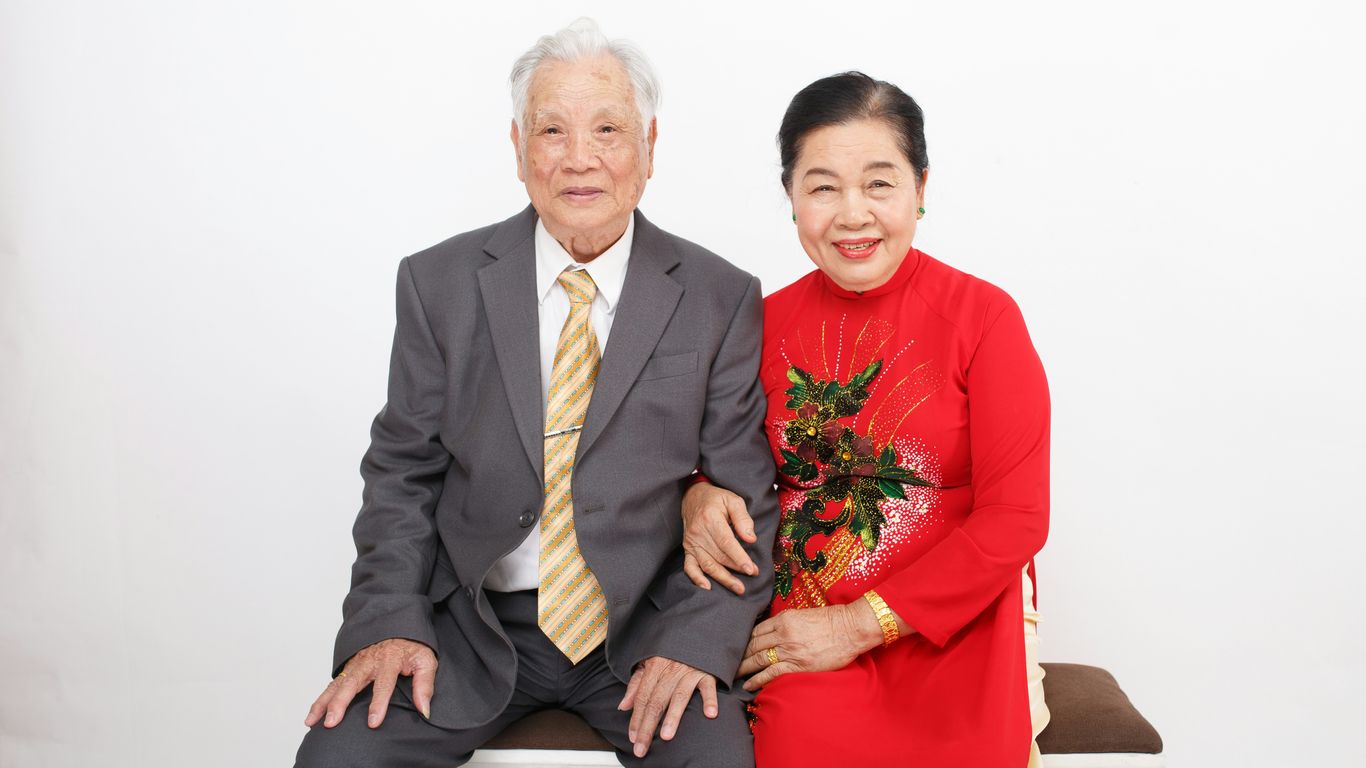 A man and a woman sitting on a bench