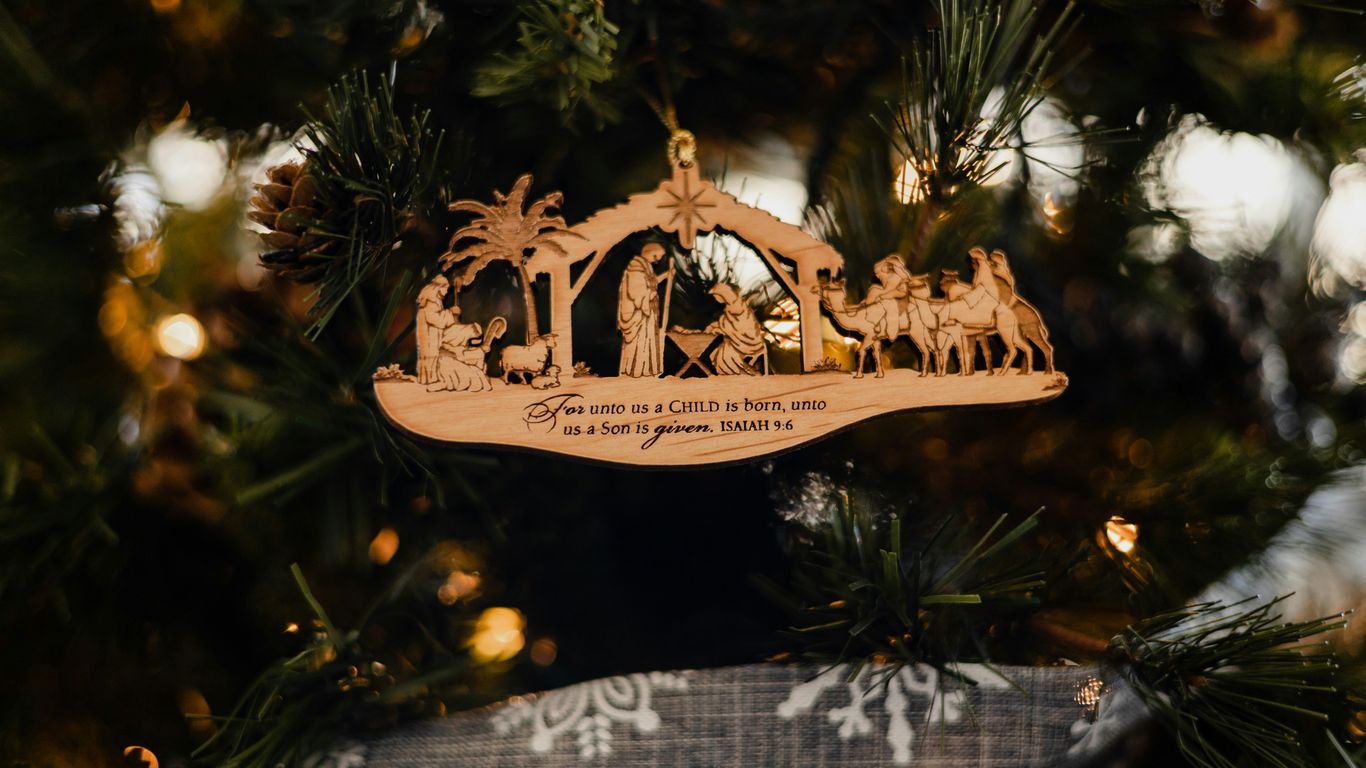 a christmas ornament hanging from a christmas tree