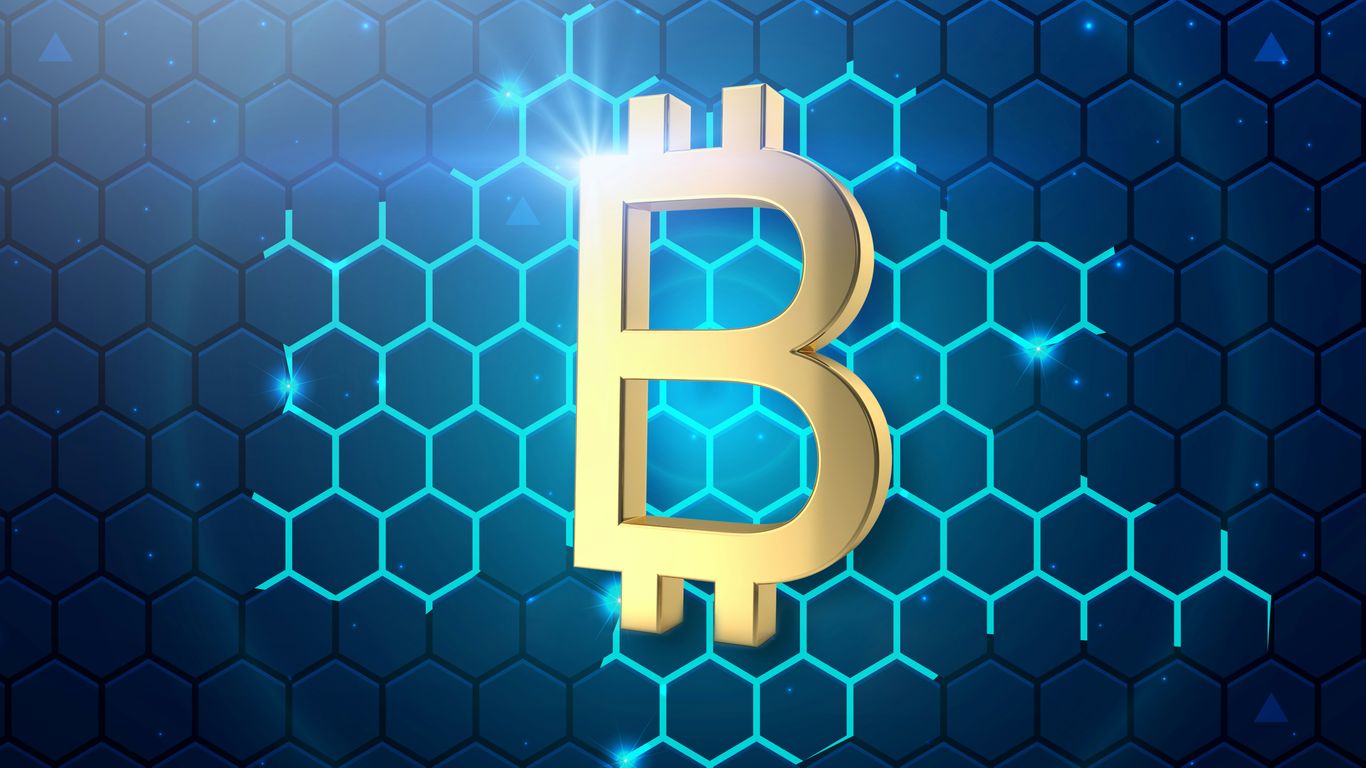 a golden bitcoin on a blue hexagonal background