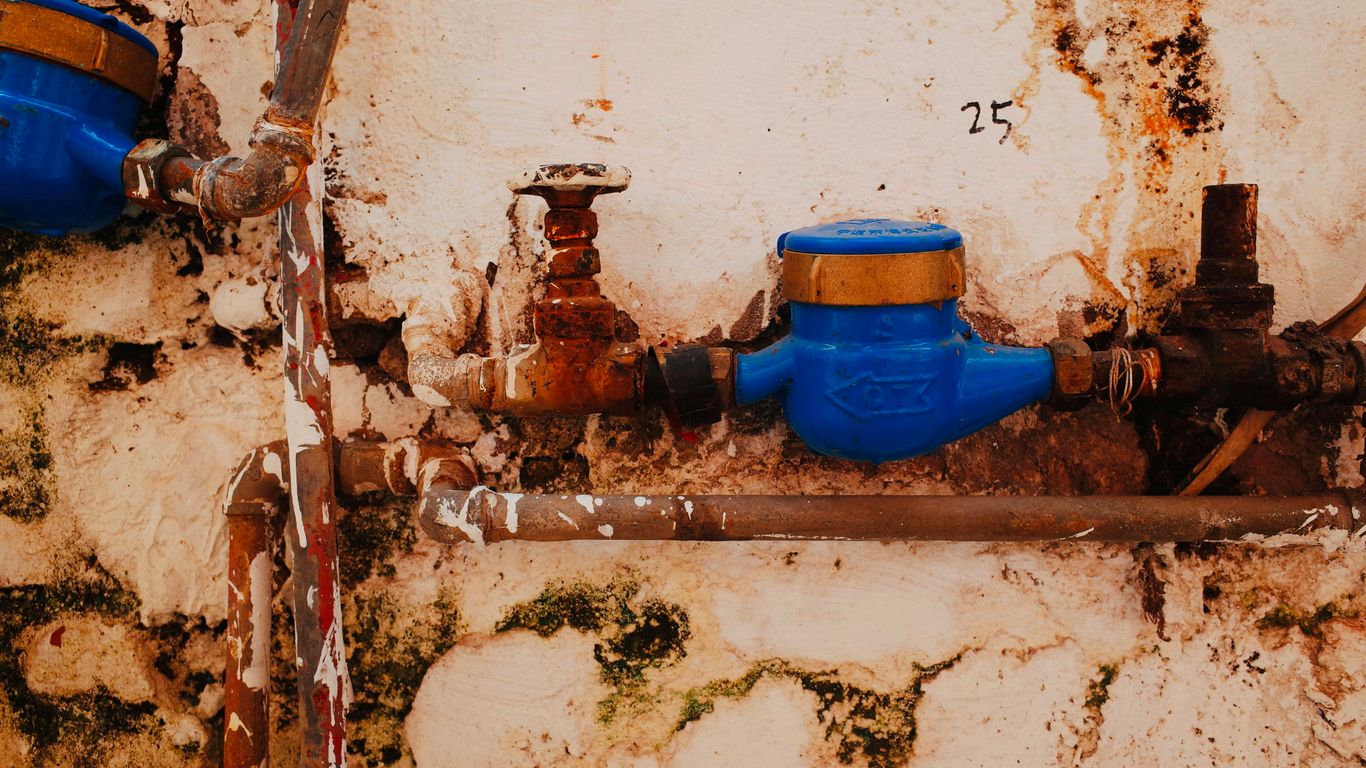 blue propane tank on brown wooden table
