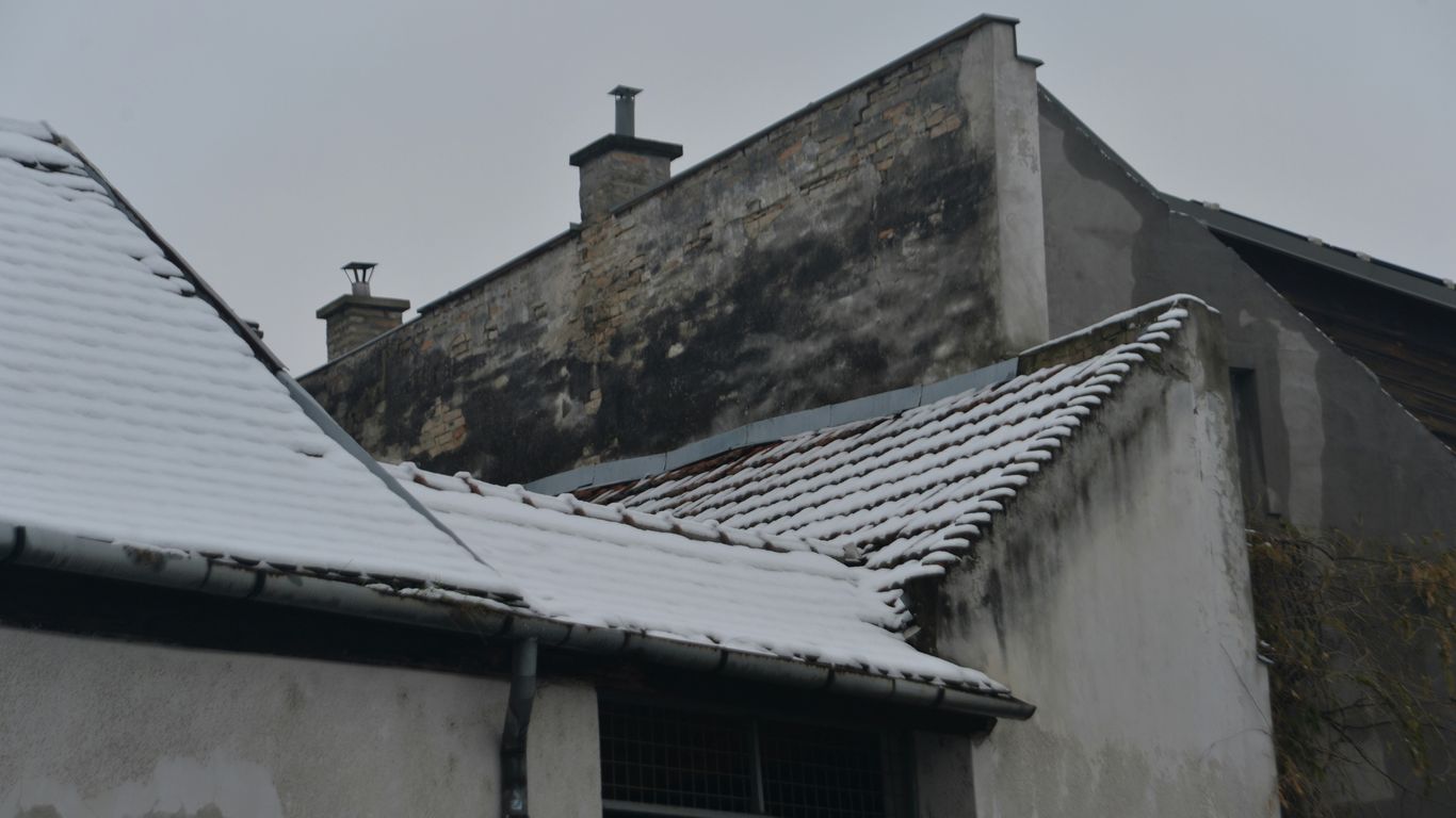 the roof of a building is covered in snow