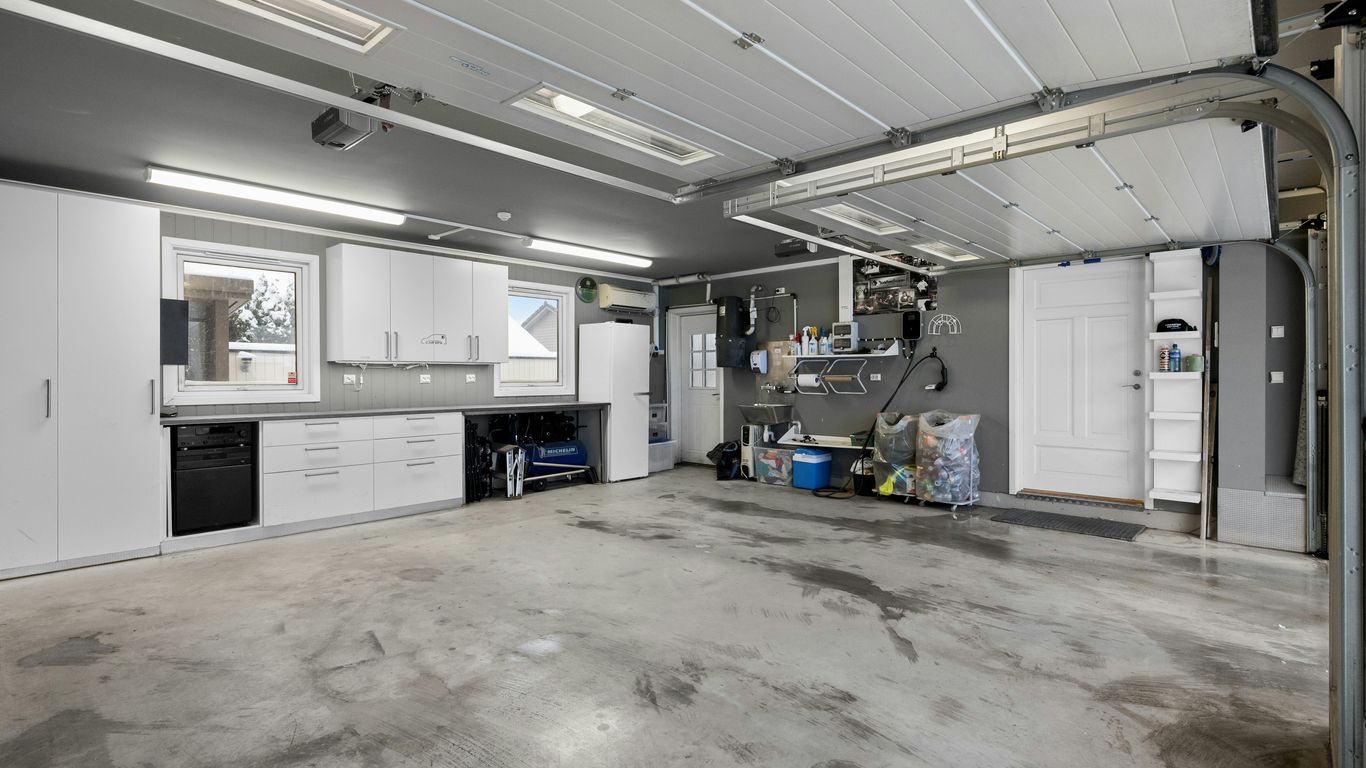 A large room with a lot of white cabinets