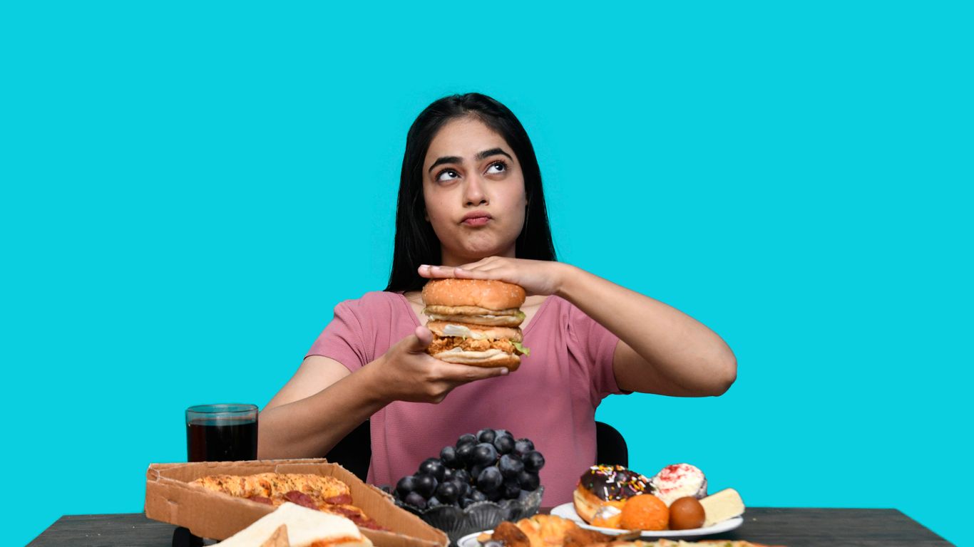 a woman holding a burger