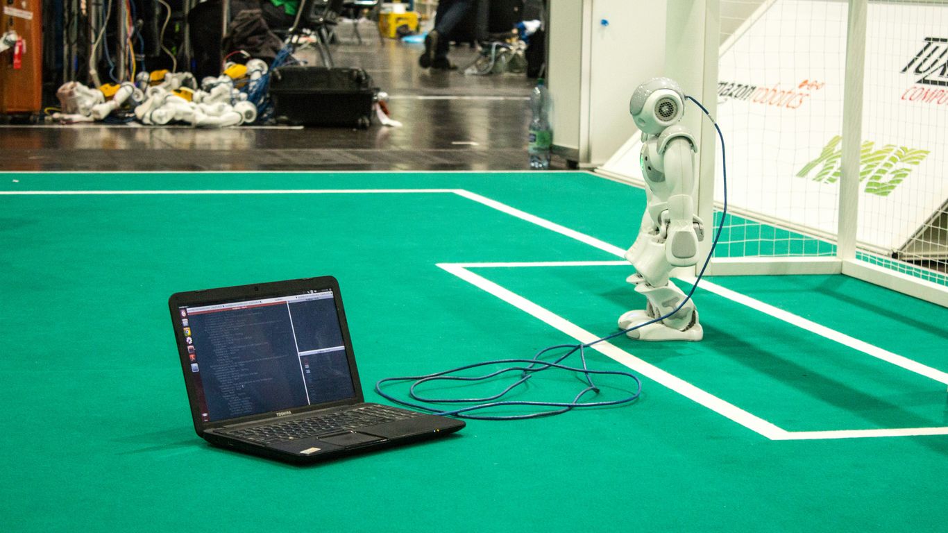 black tablet computer on green table