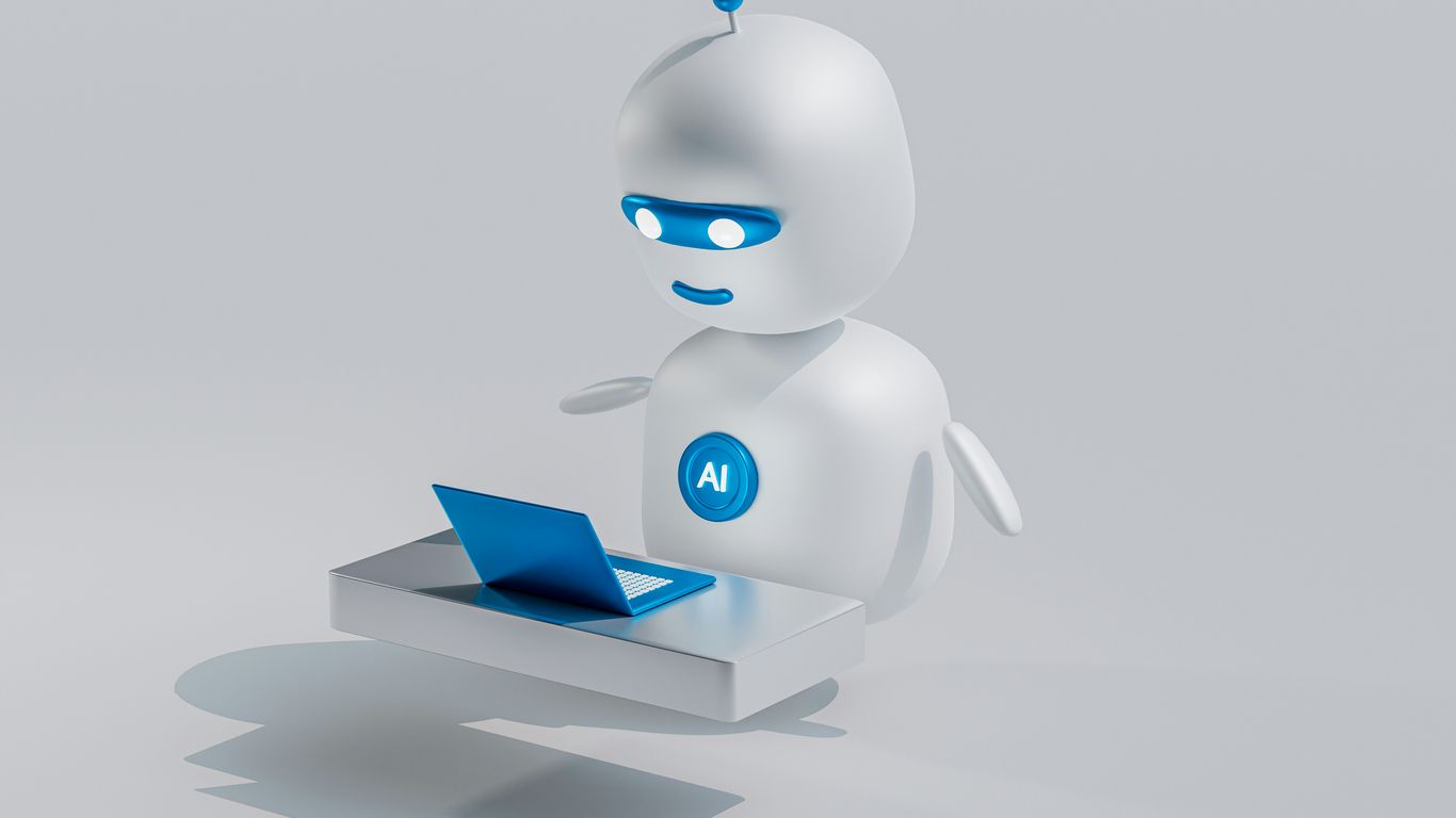 a white robot with blue eyes and a laptop