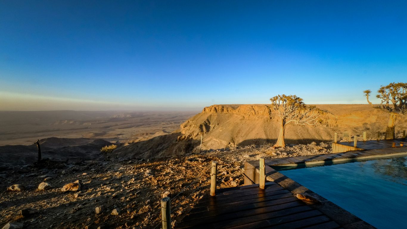 A large swimming pool in the middle of a desert