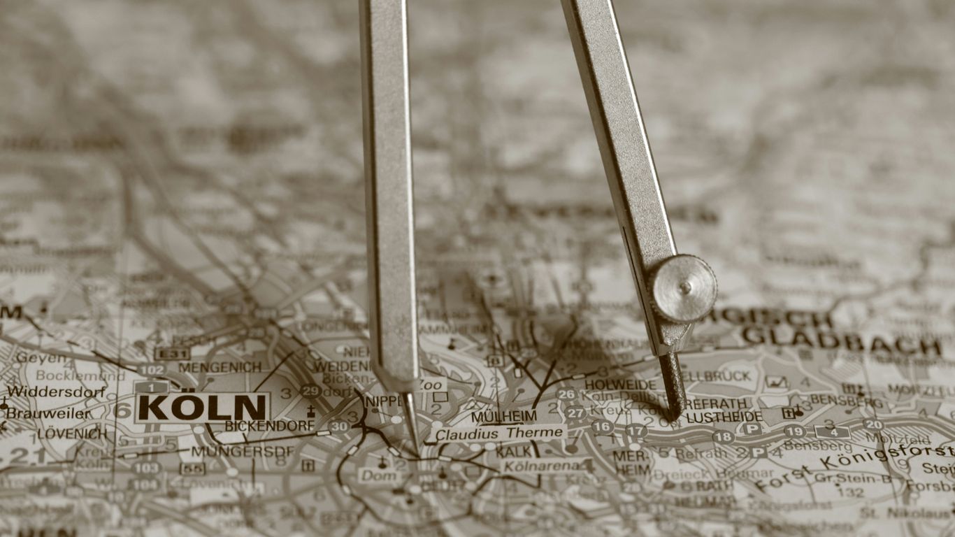 A compass resting on a map with