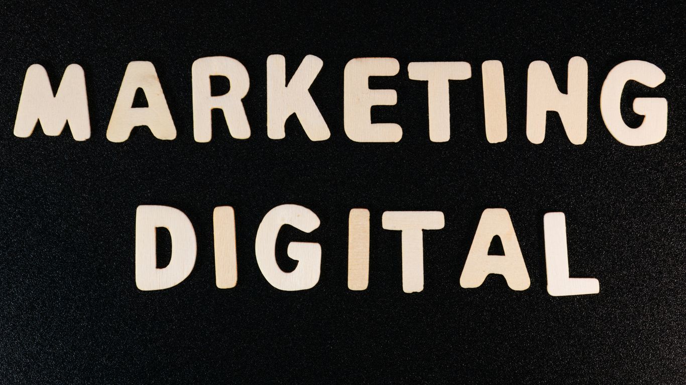 the words marketing and digital written on a black surface