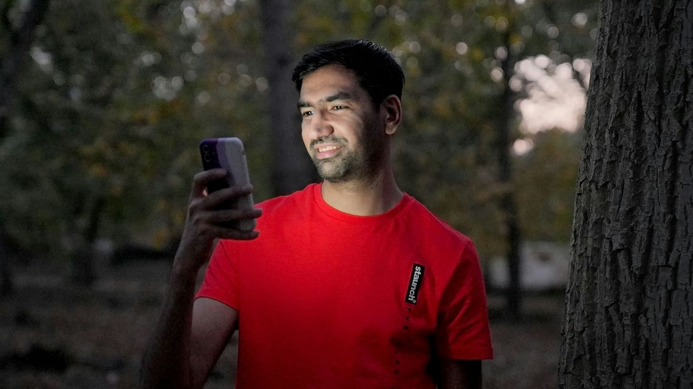 a man holding a phone