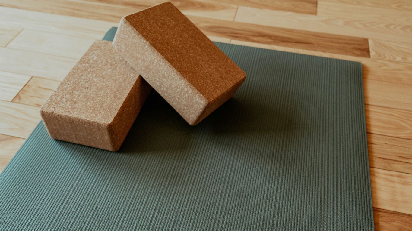 a yoga mat with two blocks on top of it