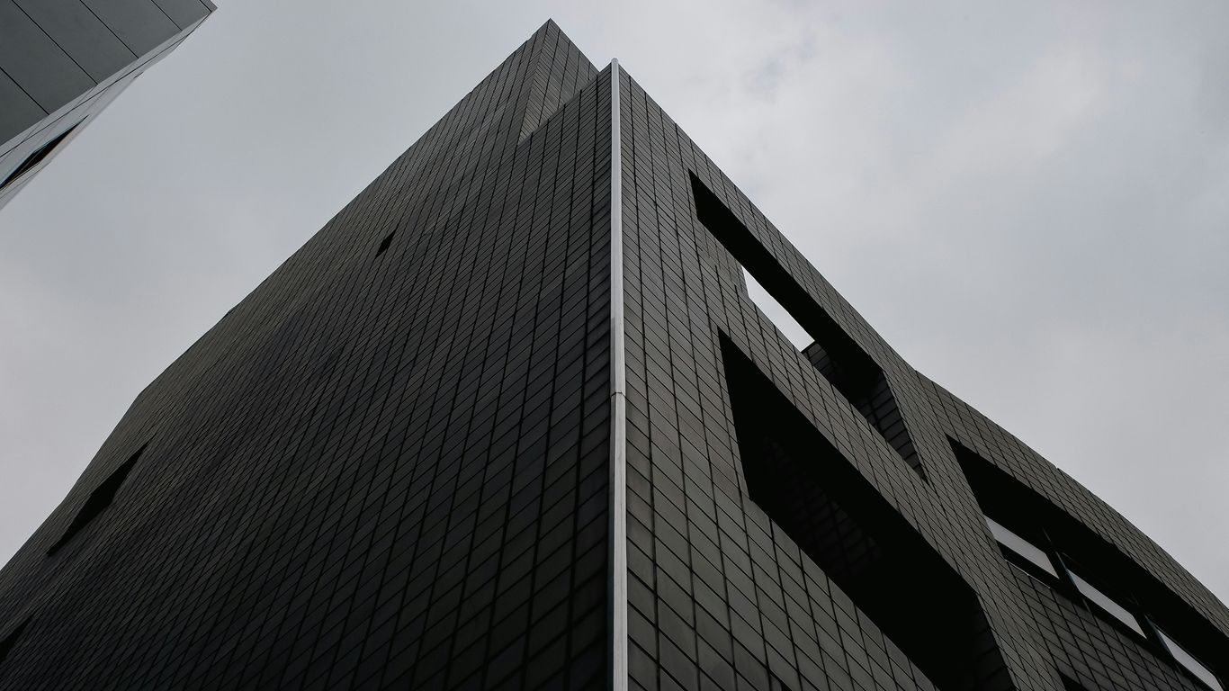 a very tall building with a sky in the background