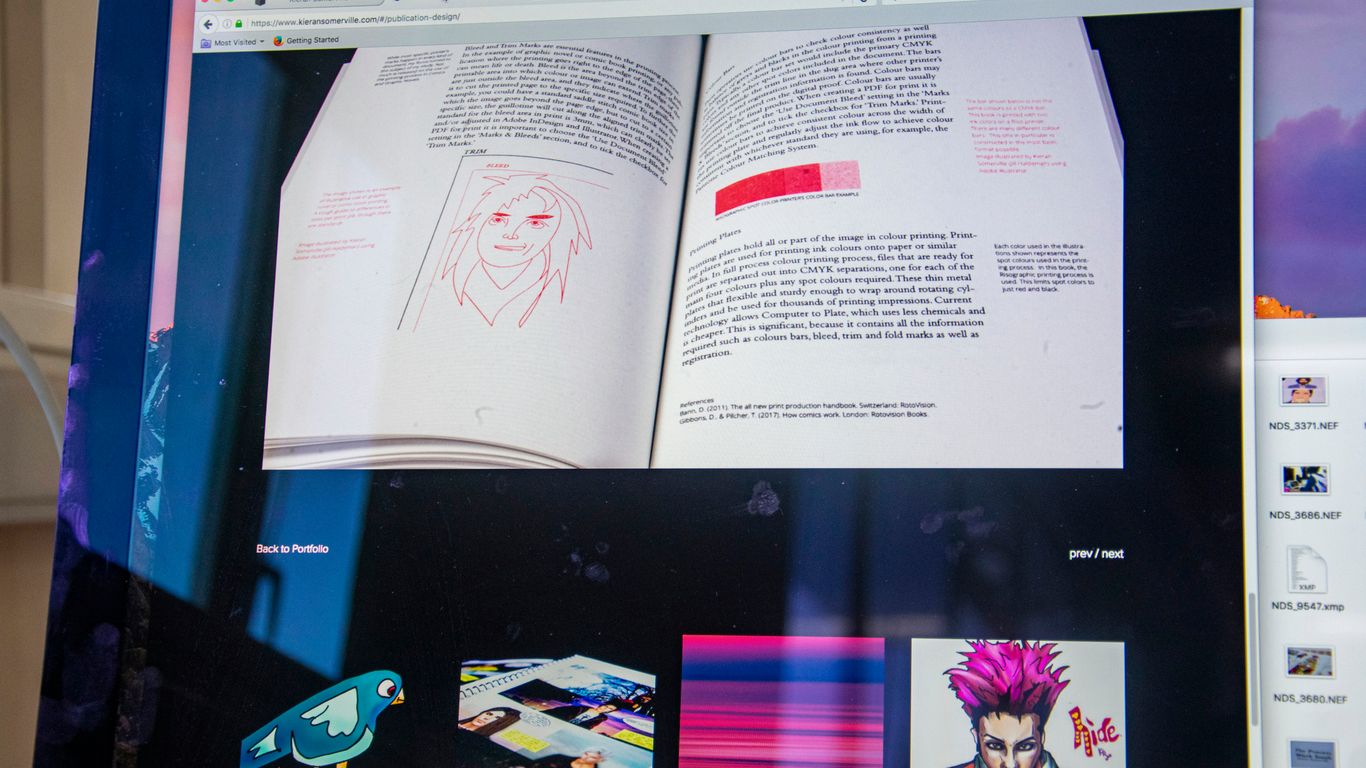 a computer screen with an open book on it