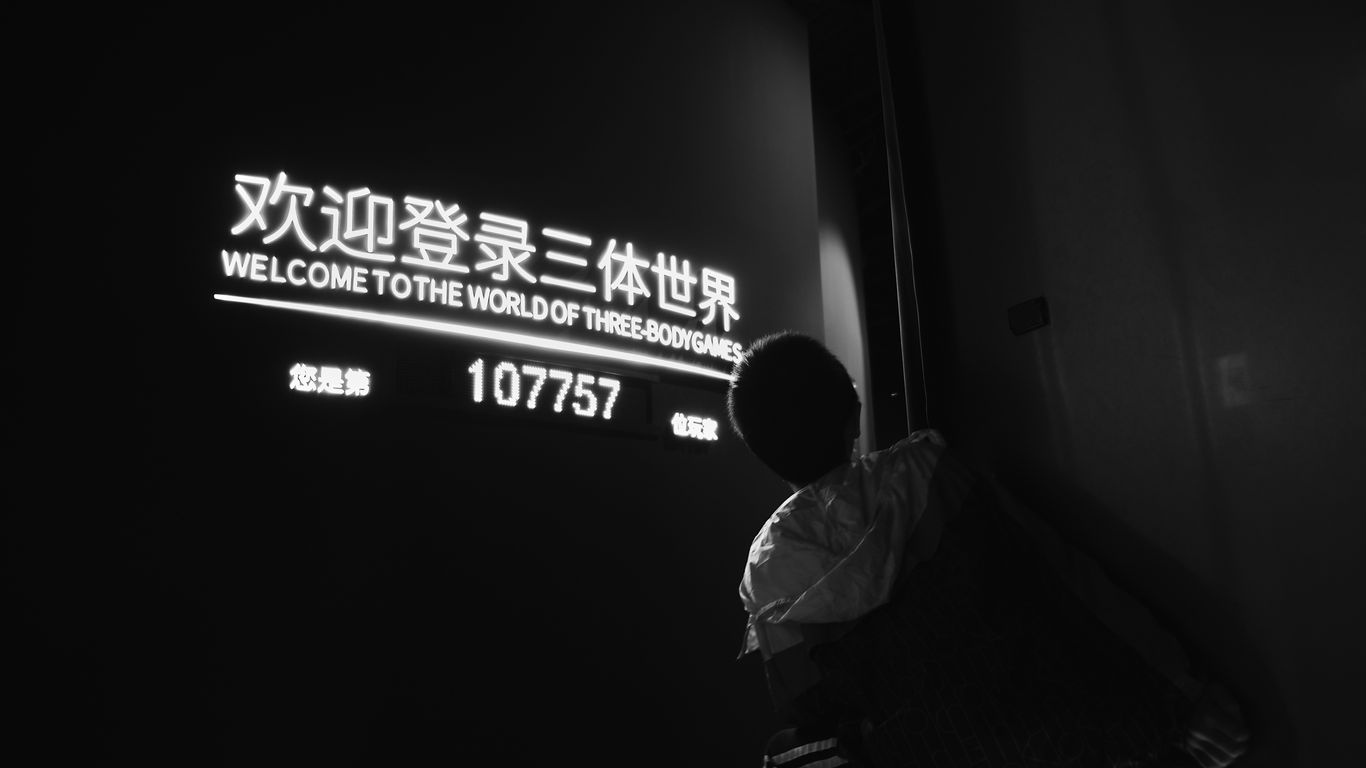 man in white dress shirt sitting on chair