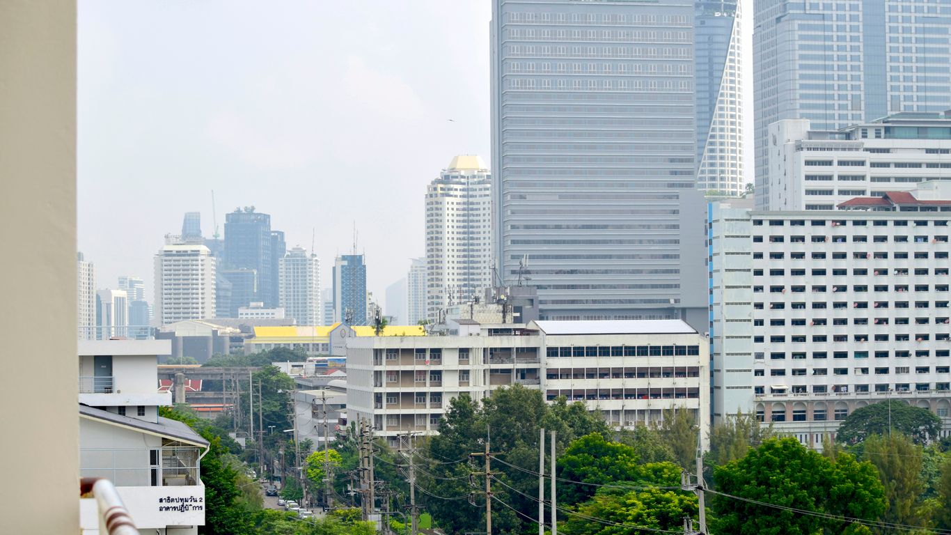 a view of a city with tall buildings