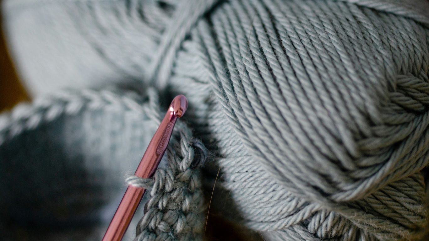 a ball of yarn and a crochet hook