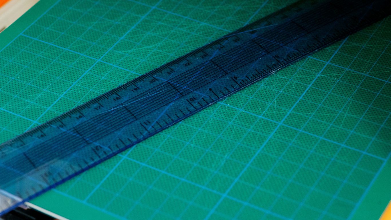 green and blue paper with ruler