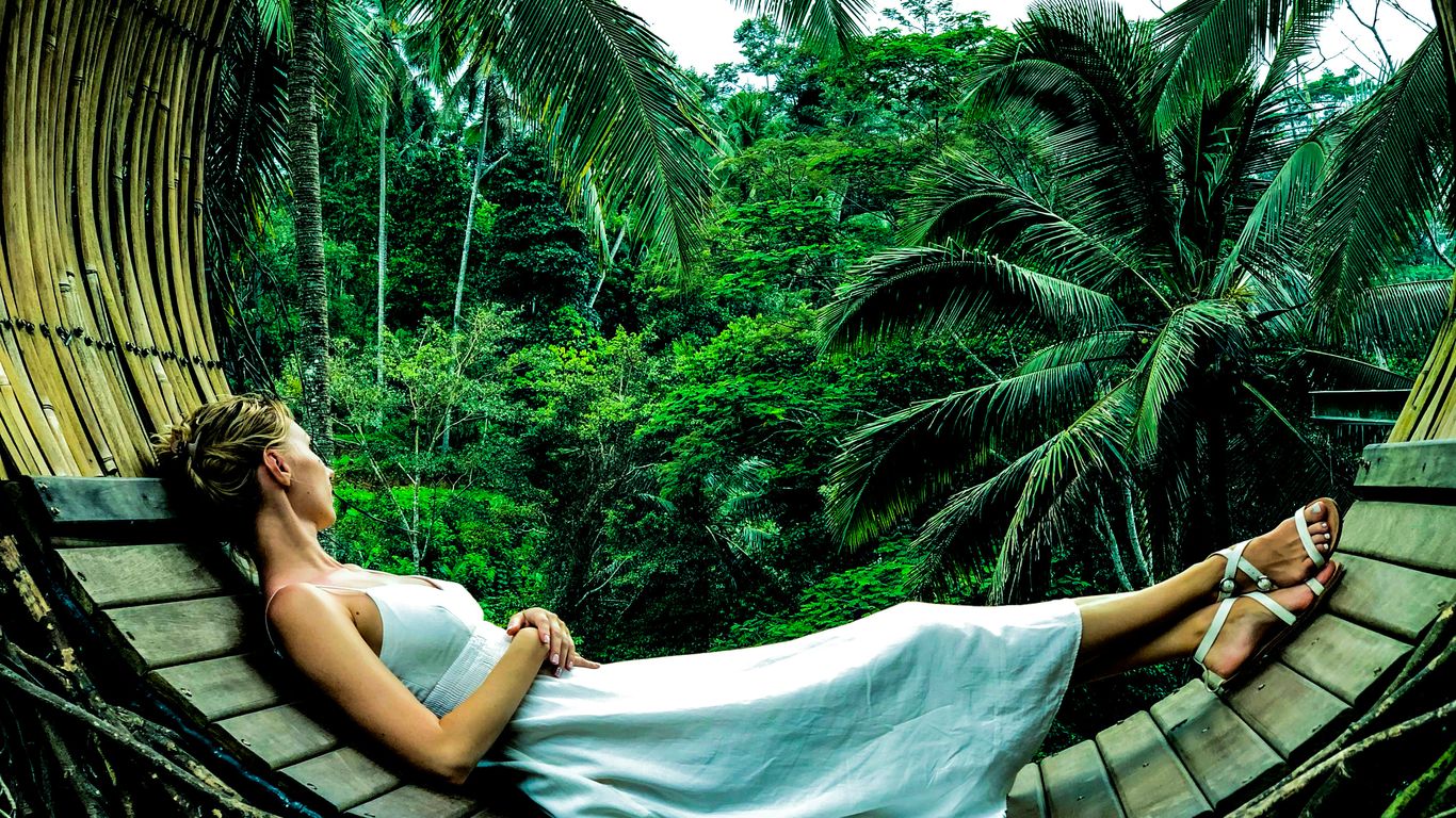 woman wearing white dress lying on brown surface