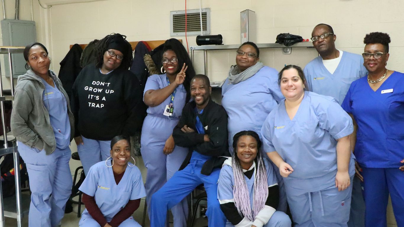 group of people sitting on blue couch