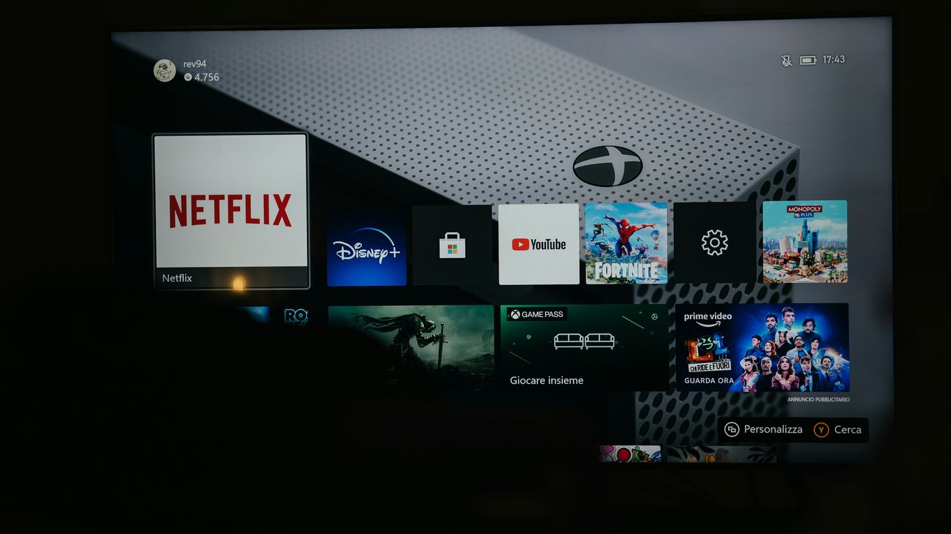 a flat screen tv with a bunch of movies on it