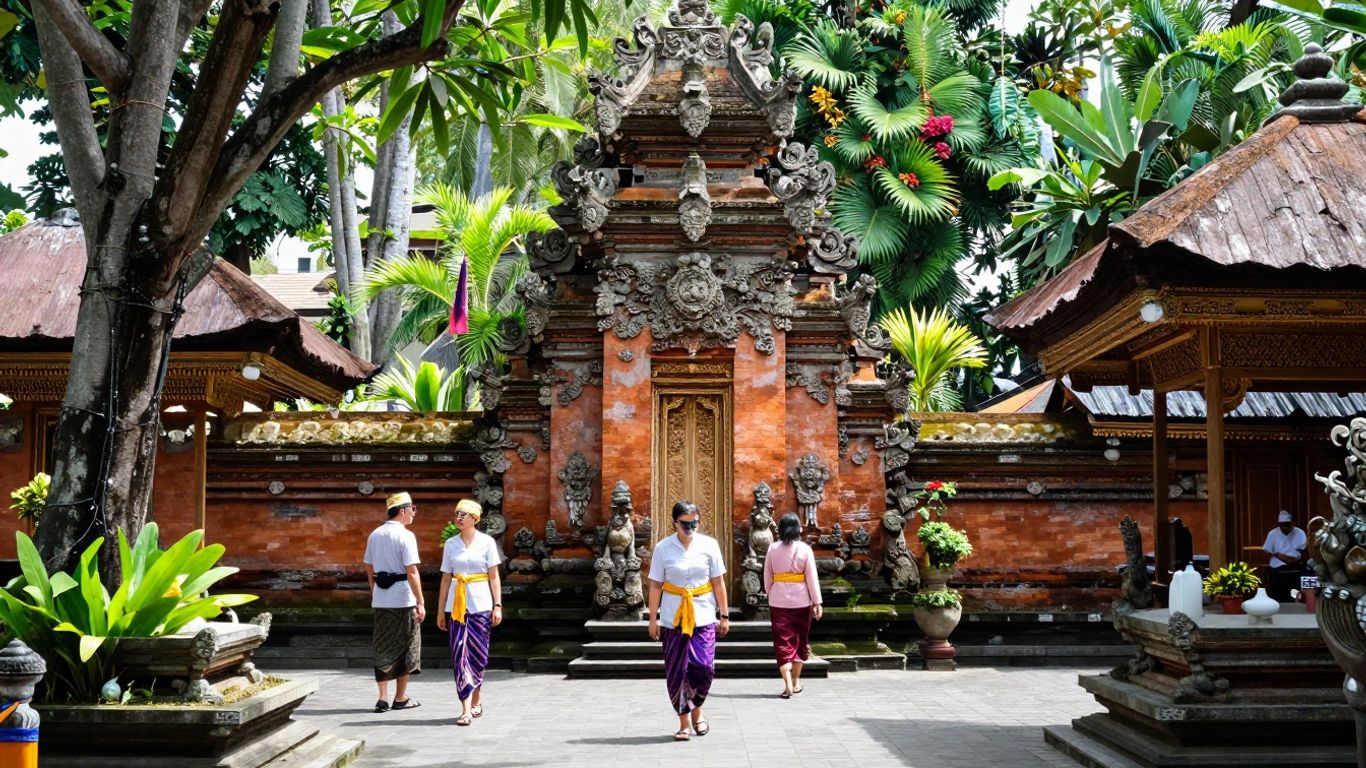 Balinese temple courtyard with tourists in sarongs.