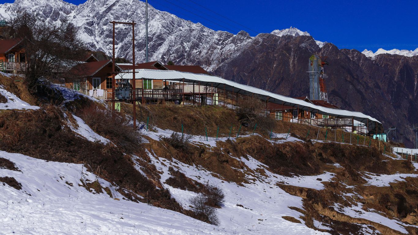 a building on a hill with snow