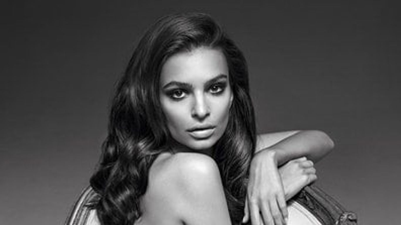 Black and white portrait of a woman with wavy hair.