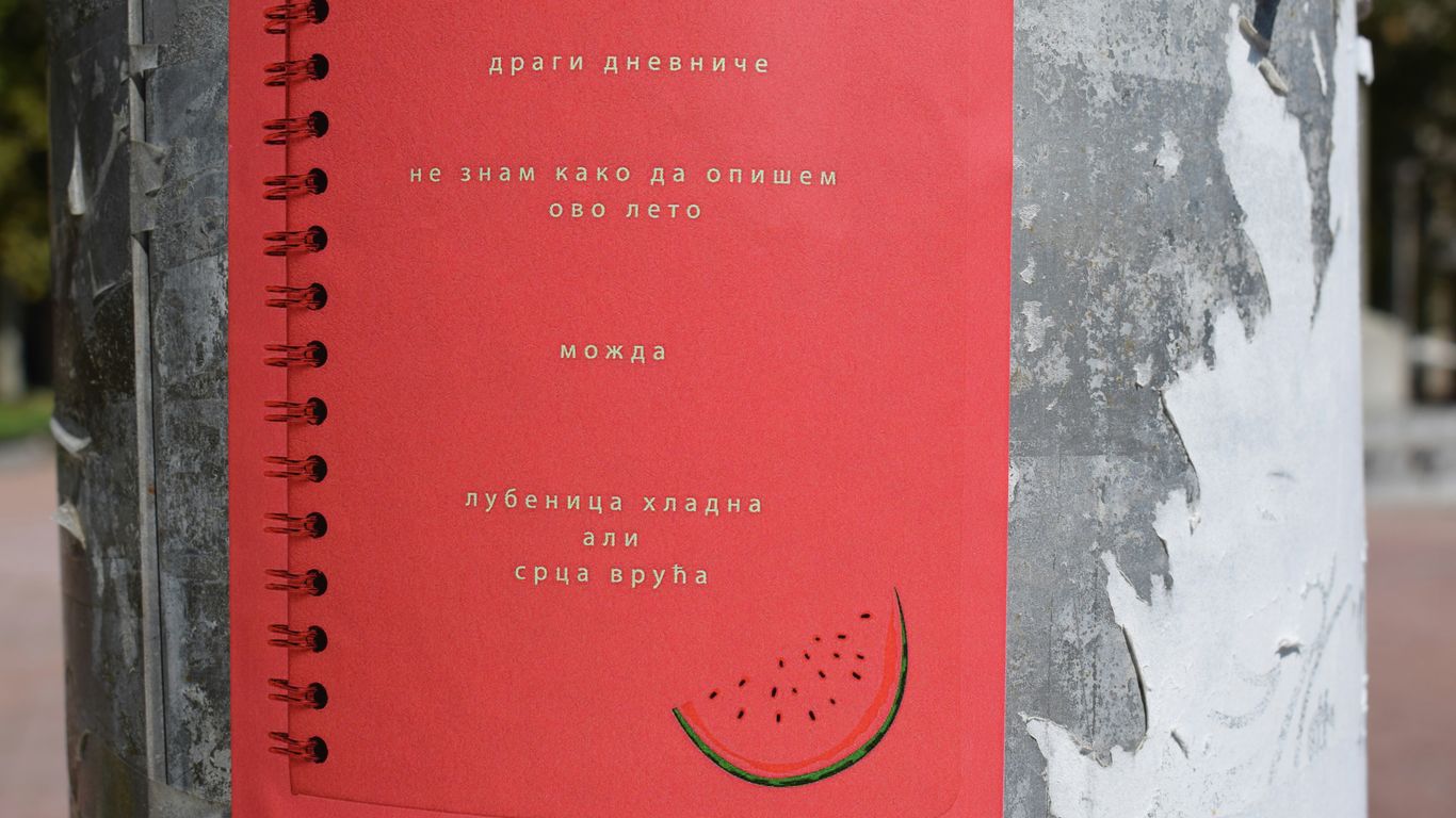 red book on gray and white concrete wall