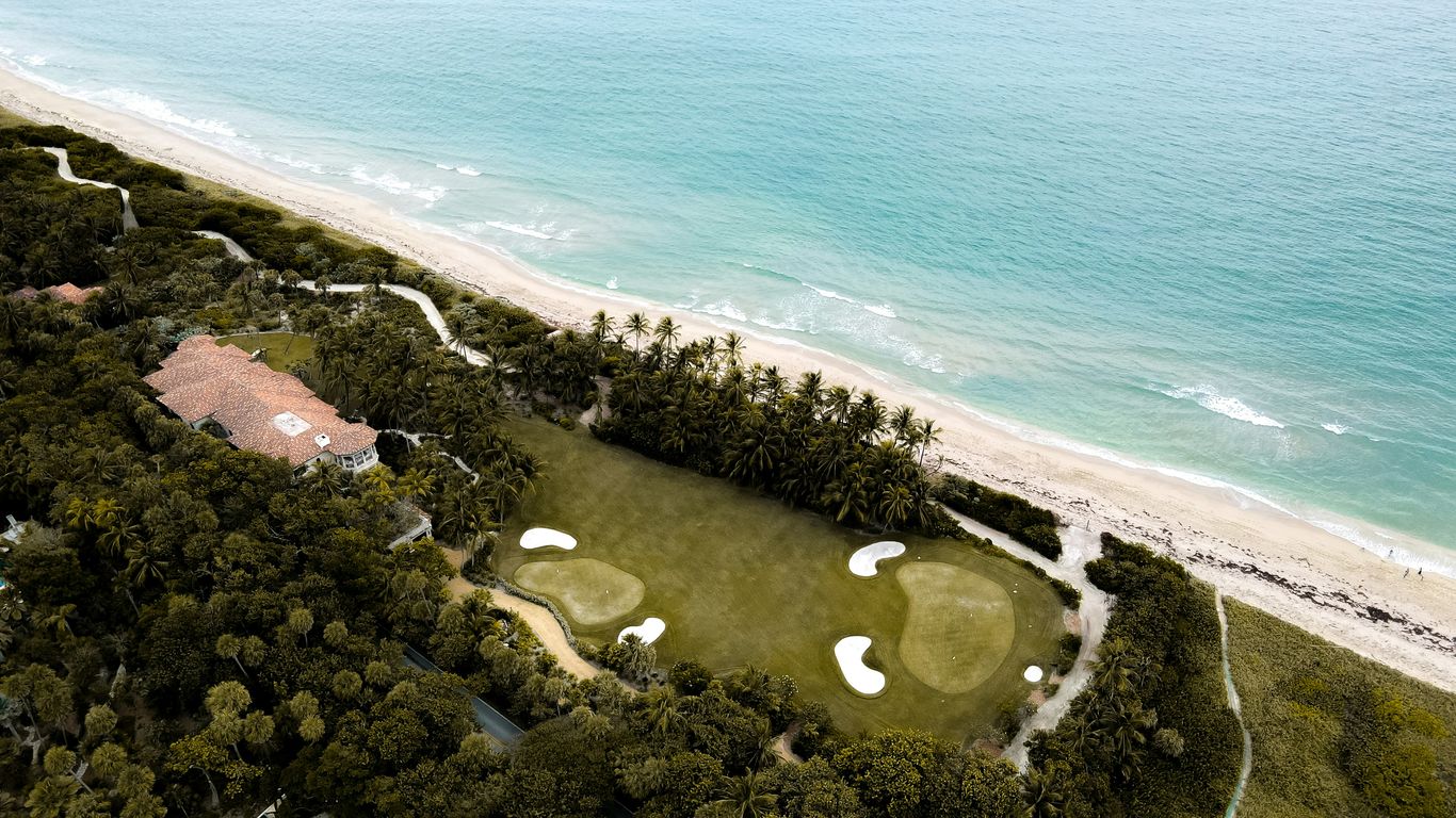 an aerial view of a golf course near the ocean