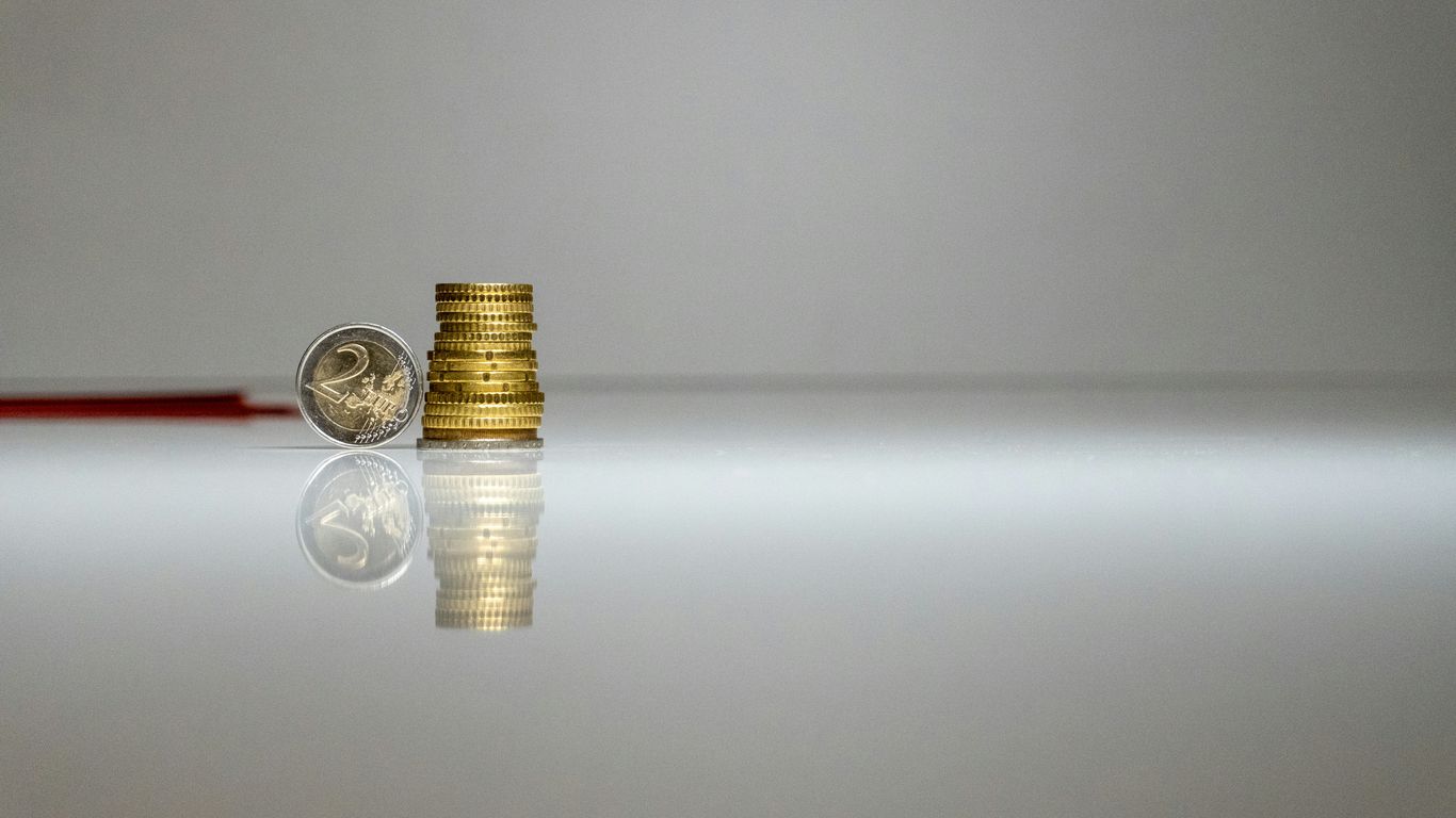 a stack of coins sitting on top of a table
